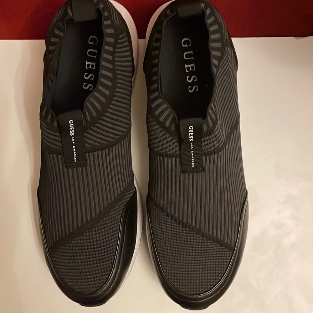 GUESS GMZOID, NWOT Men’s size 13 black slip on athletic shoes.